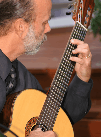 James Baird playing classical guitar